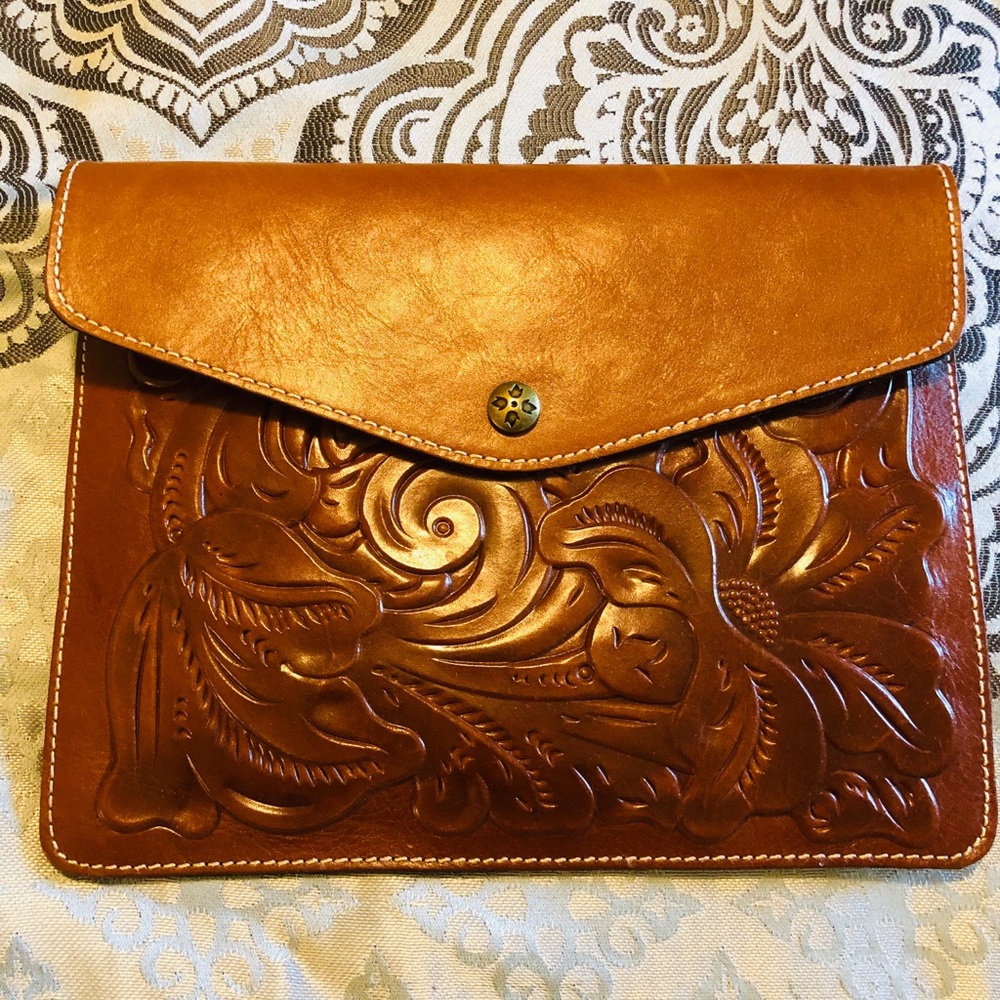 Brand new brown Patricia Nash Leather clutch.